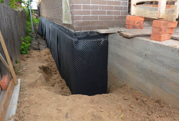 Happy homeowners after waterproofing job in Berea
